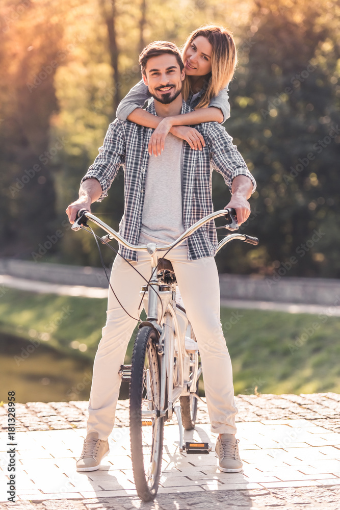 Poster couple with a tandem bicycle