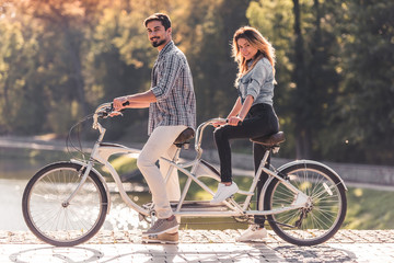 Couple with a tandem bicycle