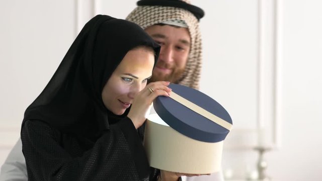 Arabic Muslim family with gift box.Middle eastern family.