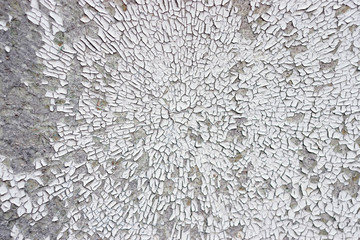 Texture Of Cracked And Crumbling White Paint In Circular Pattern On Cement Wall