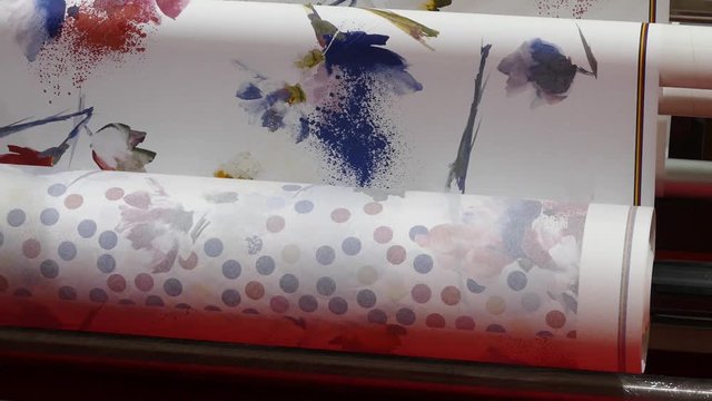 wallpaper in a roll on a drawing machine