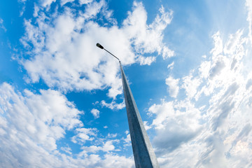 Low Angle View Of Metallic Street Lamp Against Cloudy Blue Sky