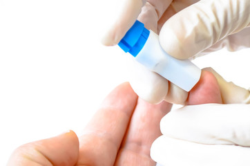 Finger blood test in a hospital. Blood from the finger. Taking blood for close-up analysis.