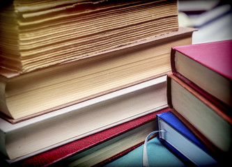 Naklejka premium Several old books with pages worn stacked, conceptual image