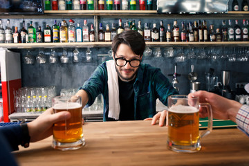 The bartender is working behind the bar