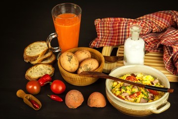 Scrambled eggs with herbs, simple, full protein breakfast with fresh herbs. Bio eggs from domestic breeding. Healthy food.