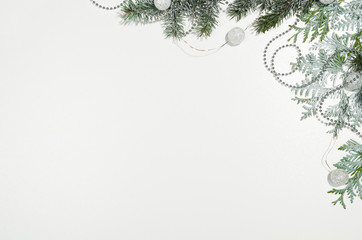 Christmas background frame top view on white seamless background with copy space around products. Decorations isolated on white. Horizontal and diagonal composition.