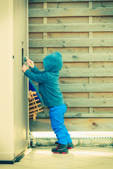 Little boy playing and having fun outside