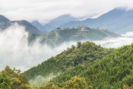 Takeda Castle Ruins, floating in the sky under the clouds. Asago City, Hyogo Prefecture, Japan
