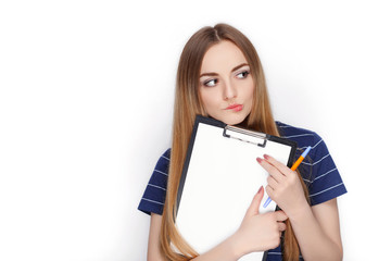 Fototapeta premium Adorable fresh looking blonde woman in blue t shirt holding clip folder. Business idea and emotion concept.