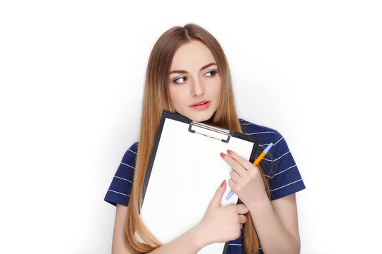 Adorable Fresh Looking Blonde Woman In Blue T Shirt Holding Clip Folder. Business Idea And Emotion Concept.