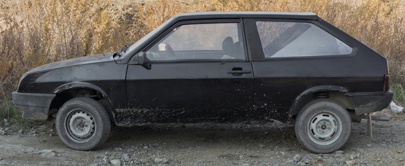 Old black car side view. Old hatchback. Retro car