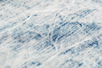 Texture of light blue jeans. Close up. Abstract background.
