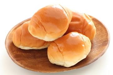 butter roll on wooden plate for breakfast image