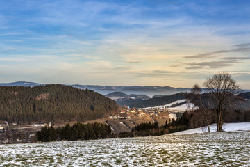 clear view to villages and hills on sunny winter day