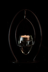 Candle and candle holder with black background