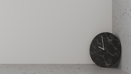 Black stone clock, copper needle leaning on the corner between the floor and the white wall. Smooth and rough surface
