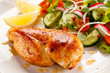 Grilled chicken fillet on white background