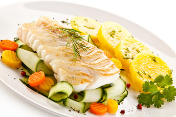 Fried fish with potatoes on white background