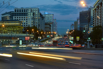 Fototapeta na wymiar Blurred motion of city traffic at dusk