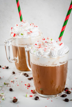 Homemade Peppermint Mocha, Christmas Coffee Drink With Candy Canes, Whipped Cream And Mint Syrup , On White Marble Table, Copy Space