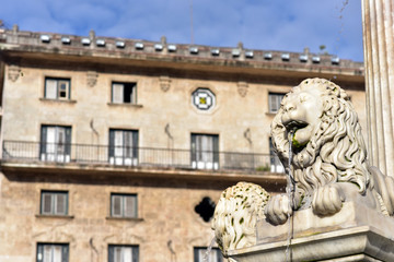 Lion Fountain (Fuente de los Leones) and historical buildings at Plaza de San   Francisco, Old Havana, Cuba