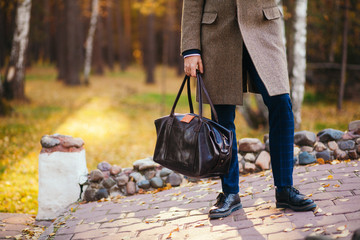 Busy man walking on street with briefcase