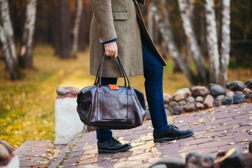 Busy man walking on street with briefcase