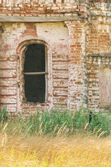 Fototapeta na wymiar Doorway in an old abandoned brick building