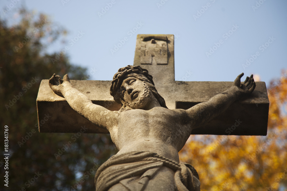 Wall mural suffering and death of jesus christ. view from the bottom of the ancient statue. (faith, religion, r