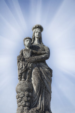 Ancient statue of the Virgin Mary with child Jesus Christ (Religion, faith, eternal life, God, the soul concept)