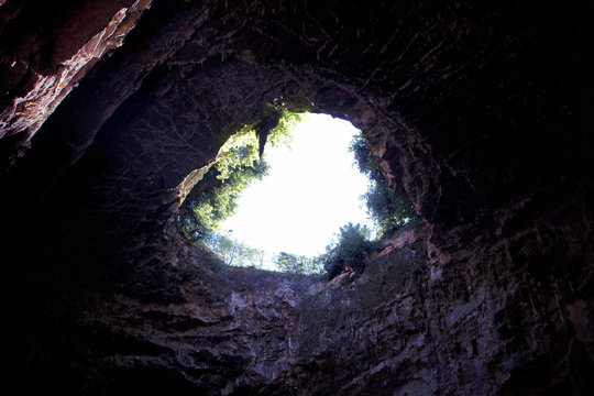 Entry hole for a huge underground cave. Speleology