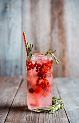 Tasty christmas cocktail with cranberry and foxberry. Shallow depth of field. Selective focus.