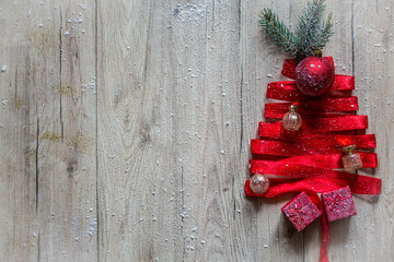 Christmas tree made of tape, on a wooden background, with gifts for Christmas and New Year, happy Christmas