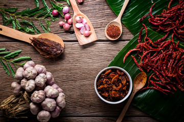 thai tradition style spicy dipping mad frop pork and shirmp with spicy and herb for ingredient on wooden texture table