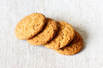 Oatmeal cookies on a light background. Oatmeal cookies on burlap.