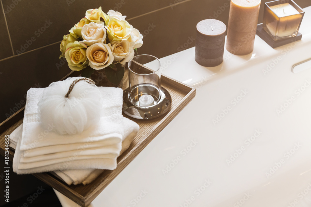 Wall mural equipment and body stuff on bathtub in white restroom