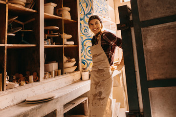 Female potter in pottery workshop