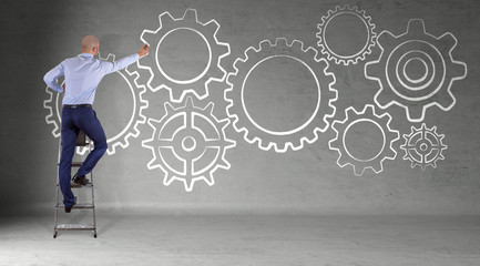 Businessman drawing gears sketch on a wall 3D rendering