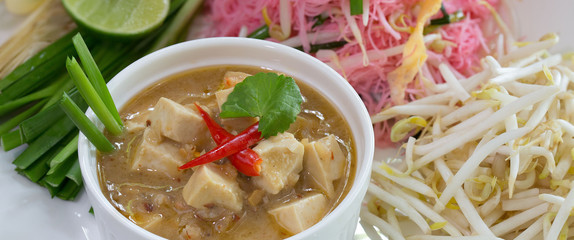 Stir Fried Noodle with coconut milk in white dish Thai food