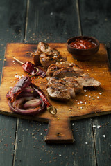 Grilled steak of pork with spices, rosemary and chili pepper