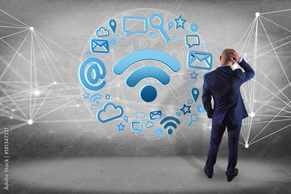 Poster businessman in front of a wall with wifi symbol connection surrounded by multimedia and internet app