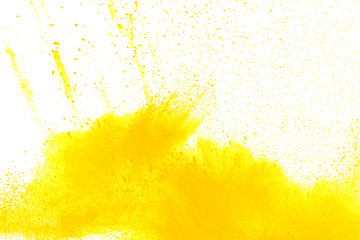 abstract yellow dust explosion on white background. Abstract yellow powder splattered on white ...