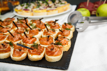 salmon bruschetta or canapes close up. Healthy food. Fish appetizer.