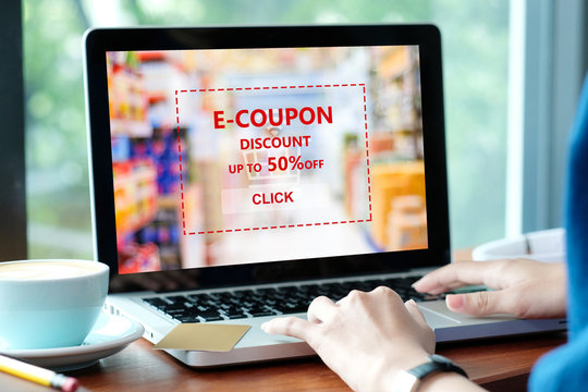 Woman hands typing laptop to get the grocery shopping on line discount coupon promotion, on line shopping ,digital marketing business and technology, lifestyle concept