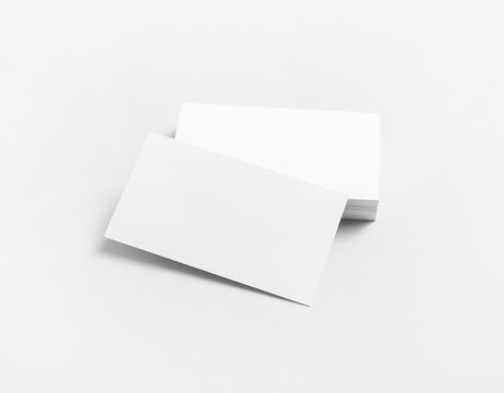 Blank white business cards on paper background. Mockup for branding identity. Template for design presentations and portfolios.