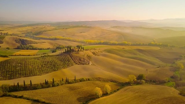 aerial view of tuscany cultivated hills at sunrise val d'orcia