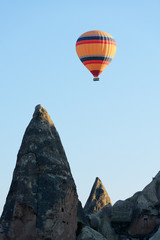 Fototapeta na wymiar Balloon silhouette in the sunrise sky