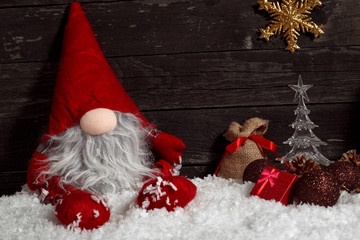 Christmas or New Year decoration-Funny Christmas dwarf on snow with decorative.