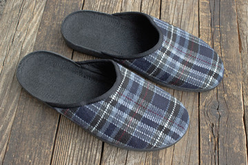House slippers on wooden floor background